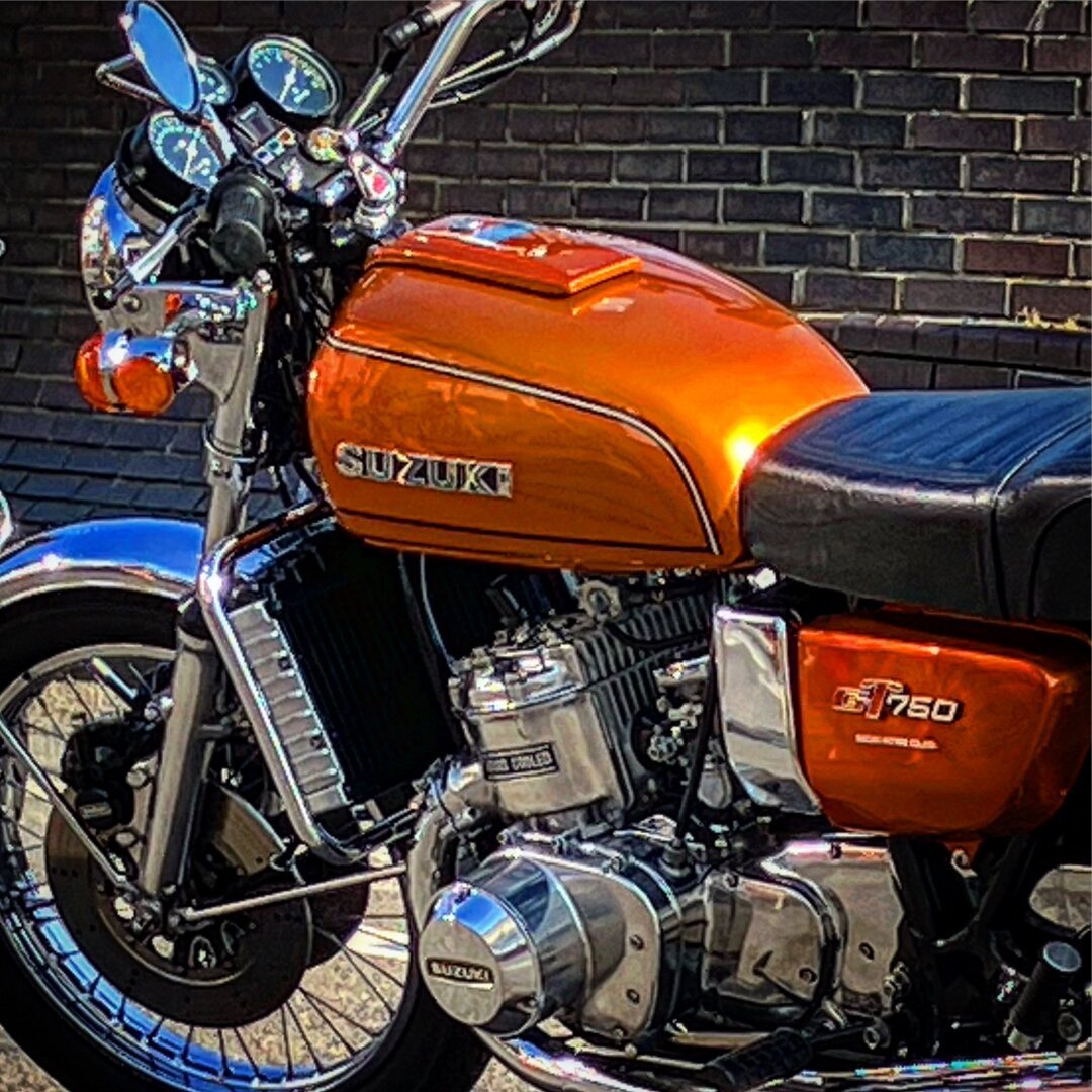 A picture of a 1976 Suzuki GT750. This bike was attending Poole Dream Machines bike night. It’s metalícese orange and is bloody gorgeous!