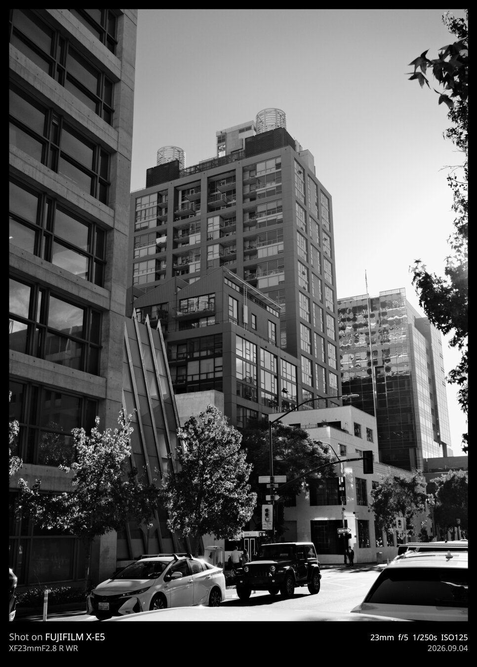 Black and white photo, high contrast, of a few modern, mid-rise buildings. The light and shadow are really the main draw of this one.