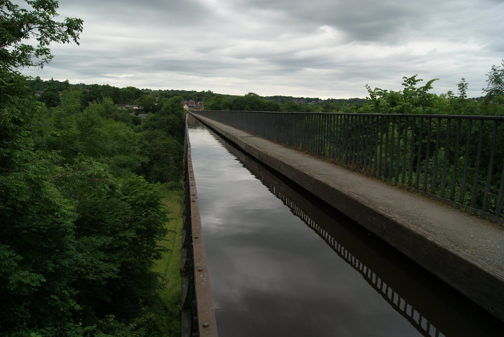 A canal goes across a high bridge with a sheer drop on one side and a footpath and railing on the other

#Wales #Water #Landscape