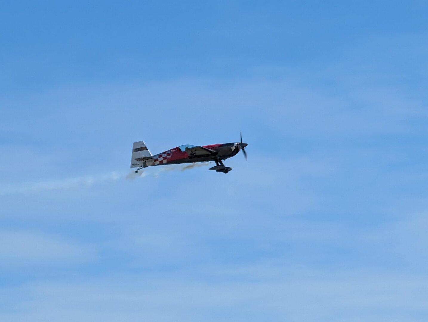 An Extra 300S airplane in flight.  It is piloted by the legendary Patty Wagstaff.
