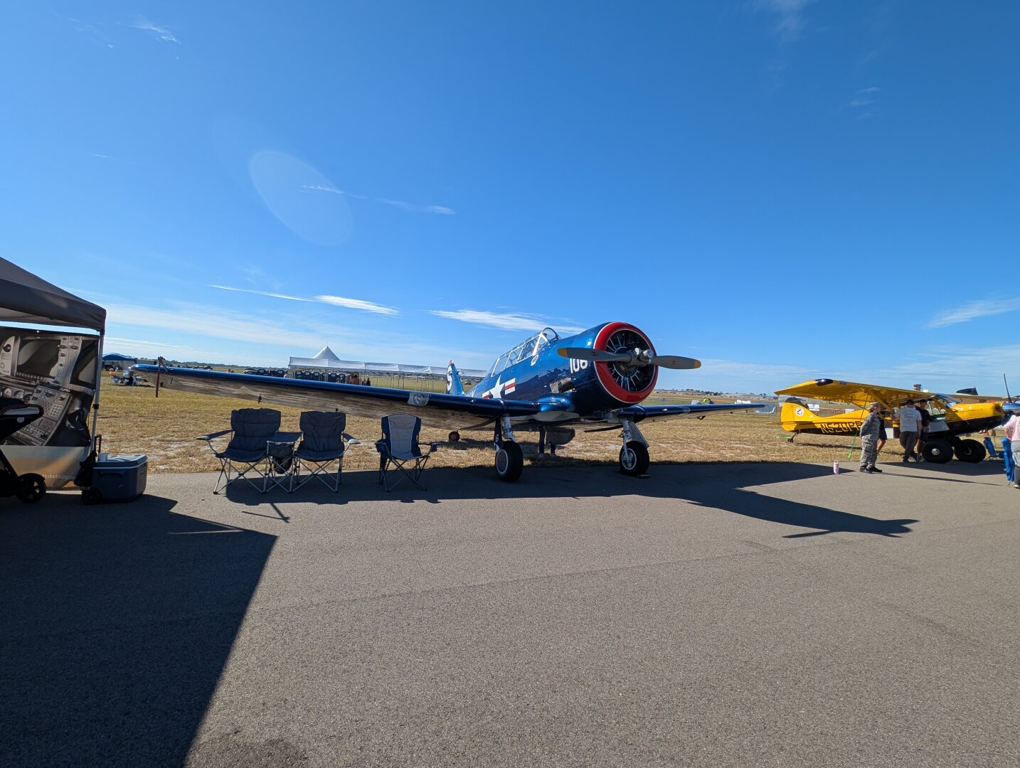 I believe this is a North American T-6 Texan variant.  The plane has a blue US Navy livery.