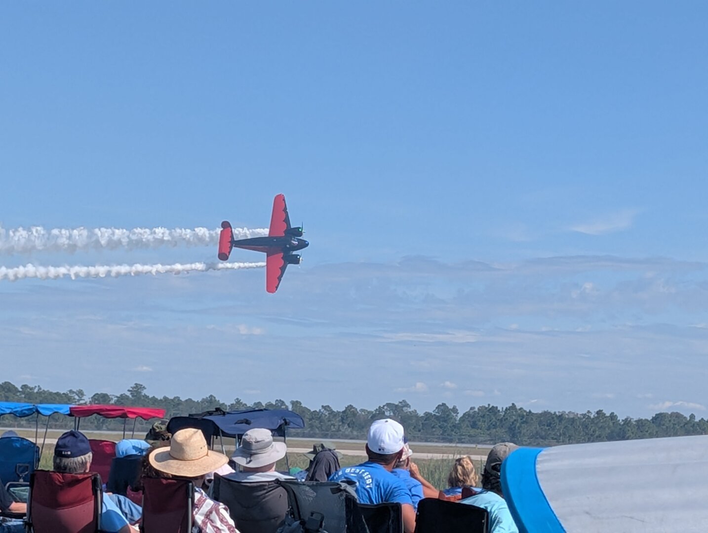 A black and red Beechcraft Model 18 airplane in flight.  The pilot is Matt Younkin.