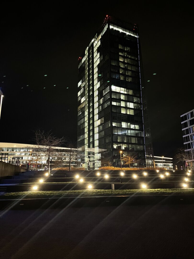 Nighttime shot with lawn terraces and decorative lights