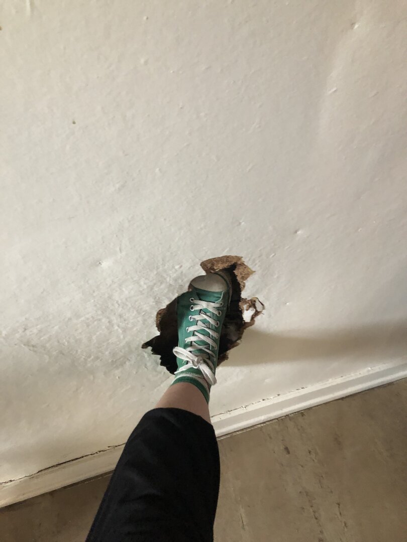 My foot through a hole in a wall.