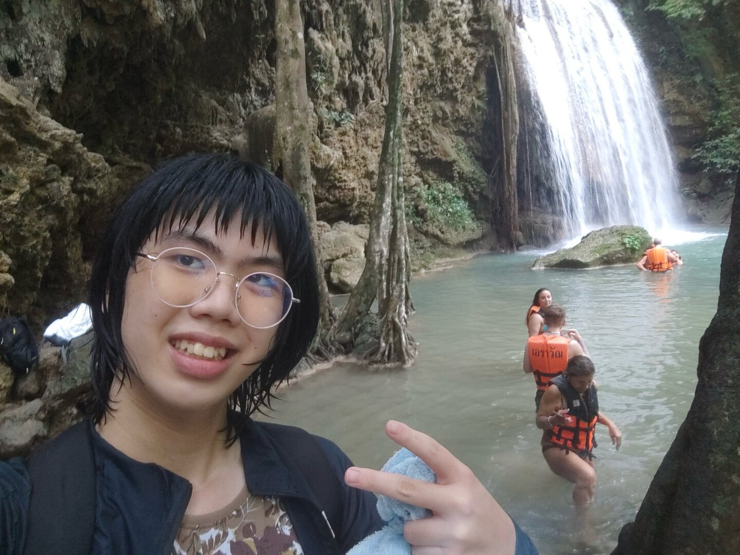 Me completely wet in front of the waterfall