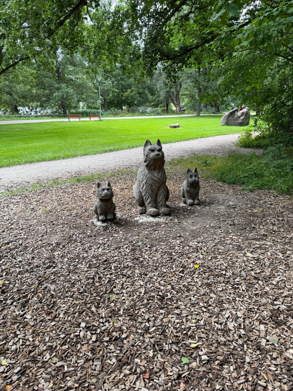 Statue of three animals in a park