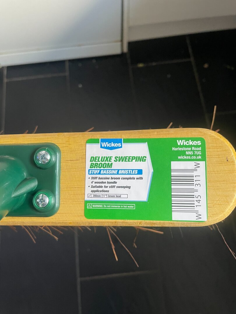 Top of Deluxe Sweeping Broom with descriptive label.