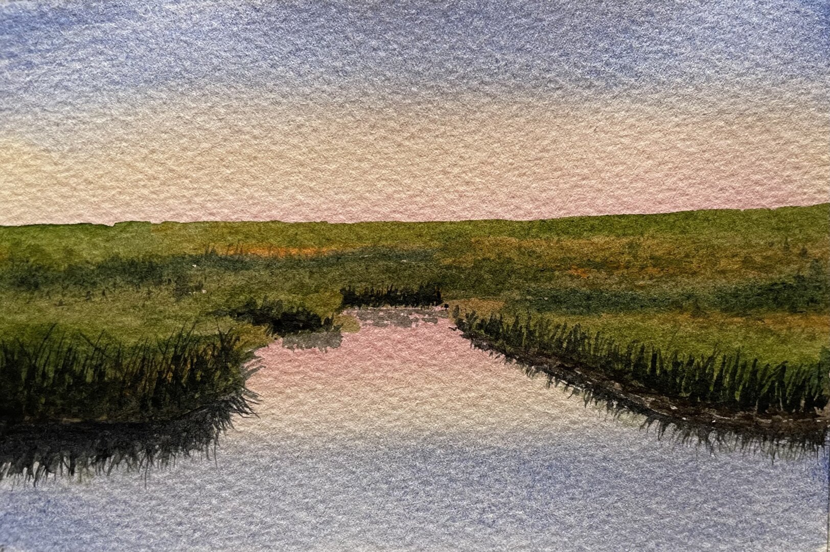 This watercolor painting depicts a serene marshland at dusk, with a reflective waterway leading into the distance, surrounded by lush green grasses and a soft pastel sky transitioning from blue to pink.