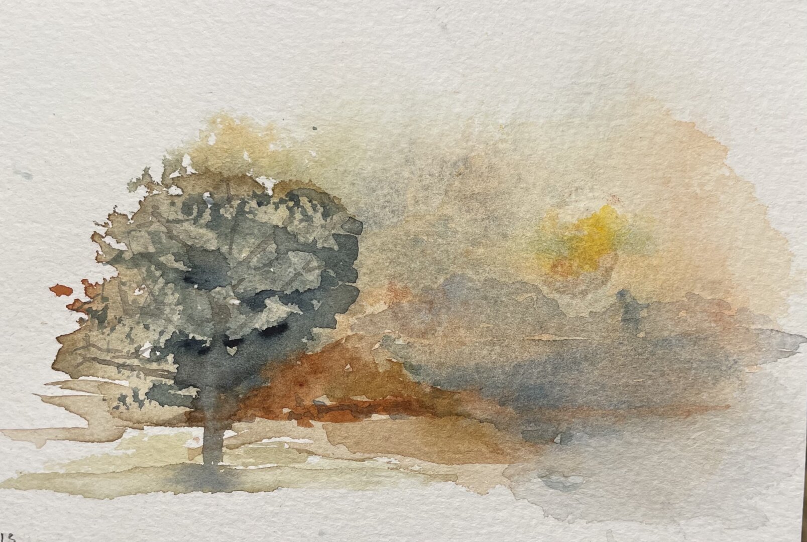 This is a watercolor painting depicting a solitary tree in the foreground with a misty, autumnal landscape in the background, featuring warm earthy tones and a soft, atmospheric quality.