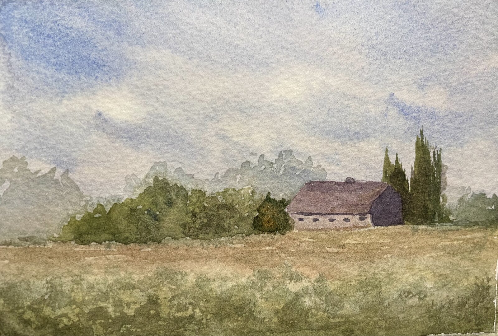 The painting is a serene watercolor landscape depicting a rustic barn nestled among lush greenery, with a soft blue sky and distant trees fading into the background.