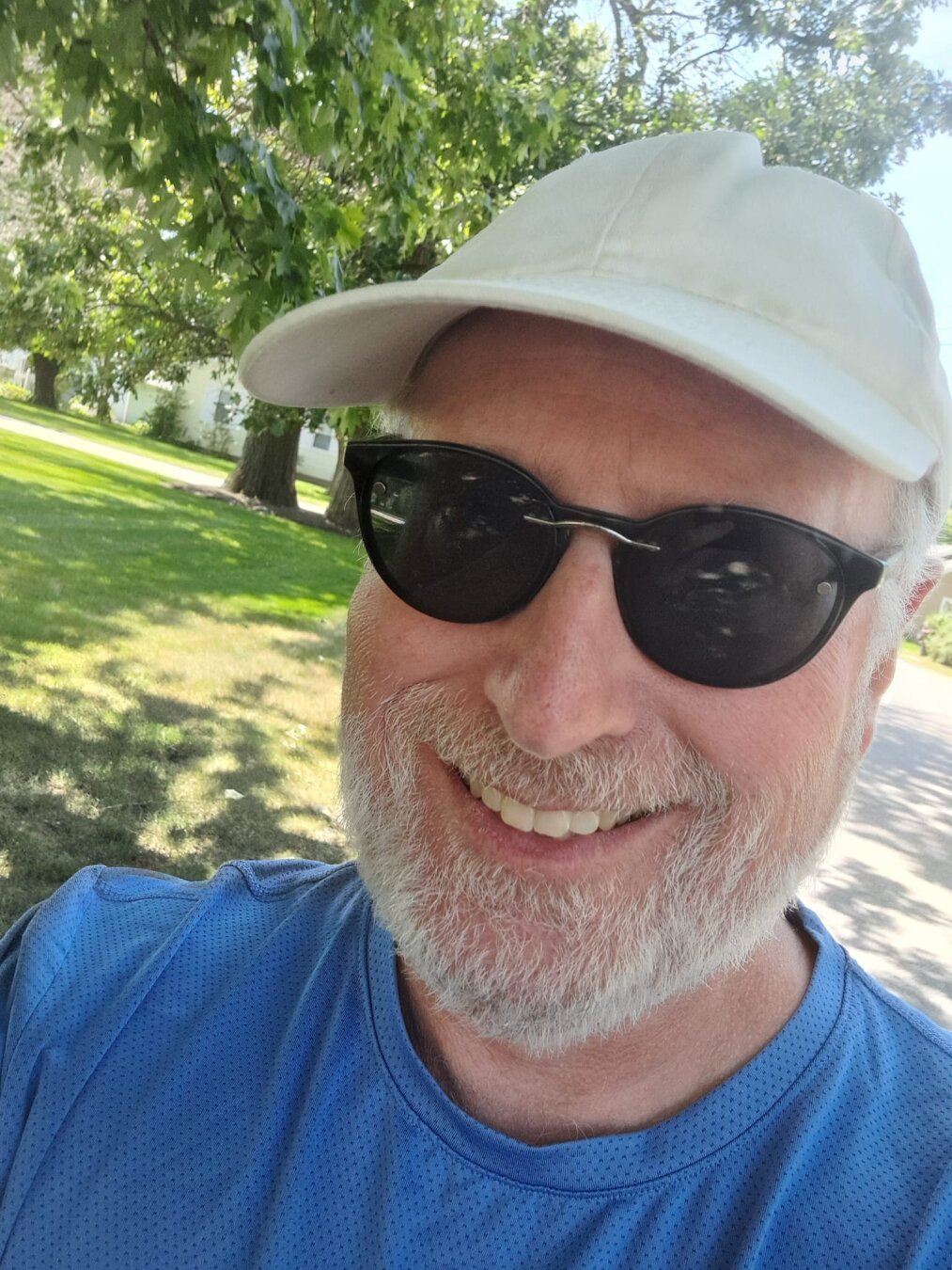 Selfie of me, 50-something, with a beard, ball cap, sunglasses.