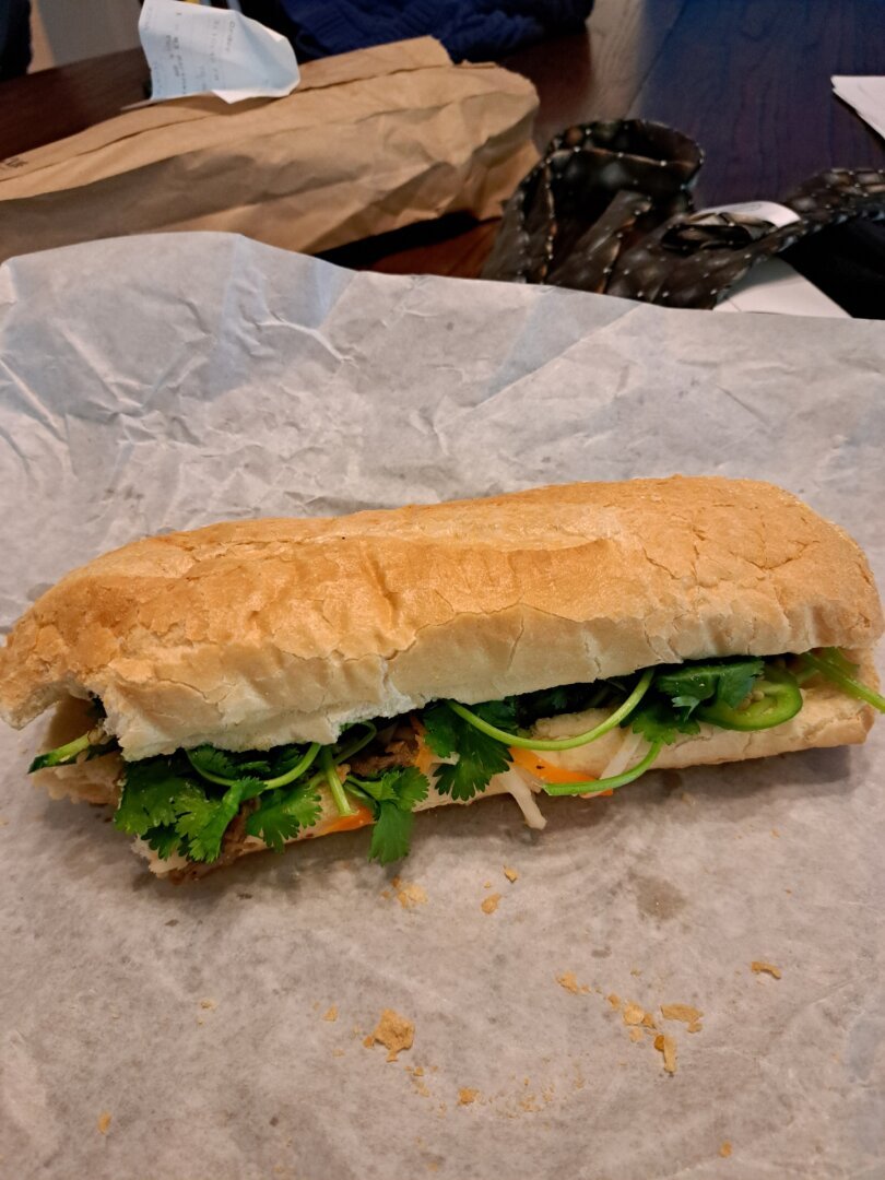 A bahn mi. 
Toasted baguette. Marinated pork. Vietnamese pickled veggies. Cilantro. 
A taste of heaven.