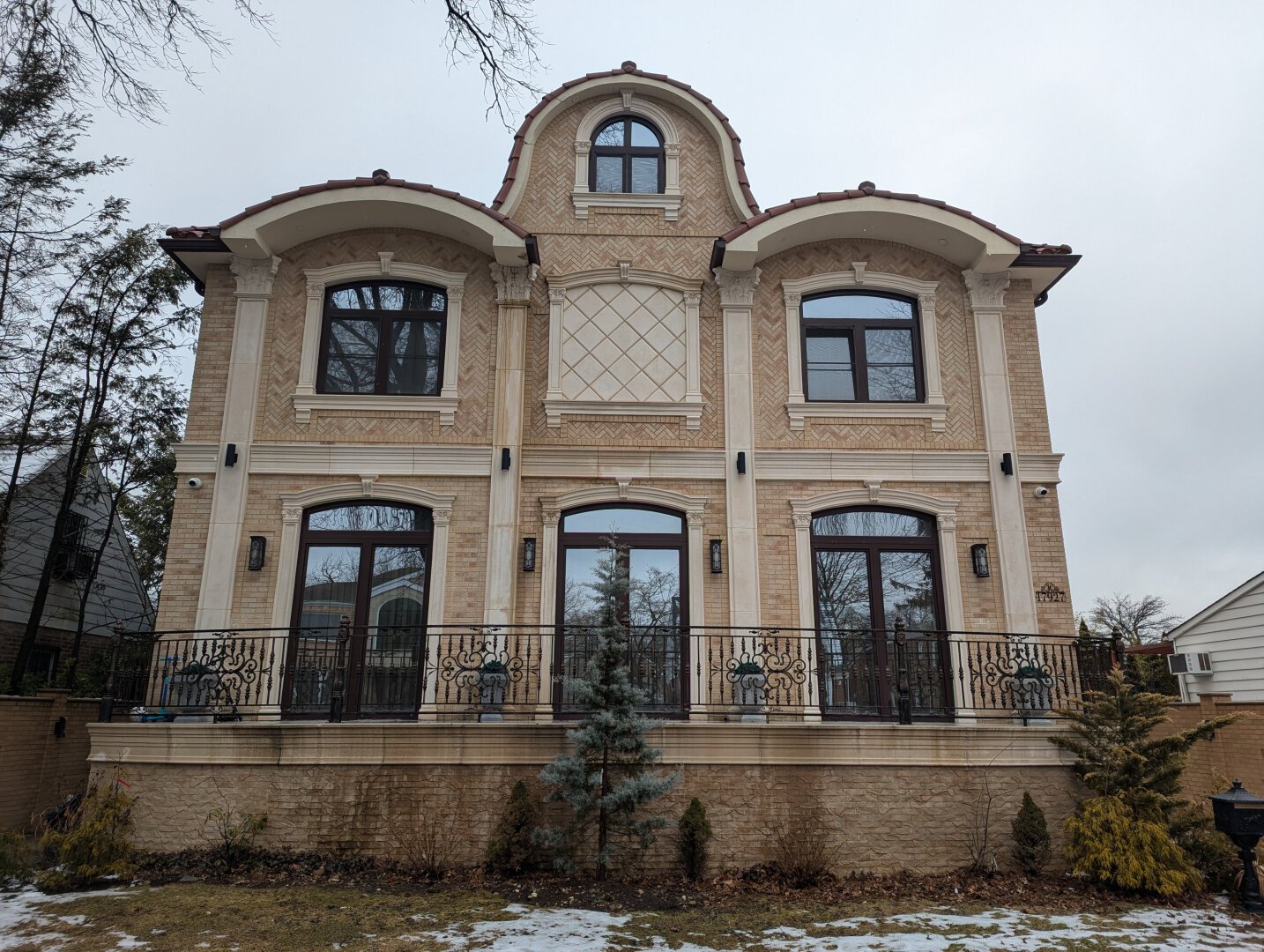 Two story beige colored house.