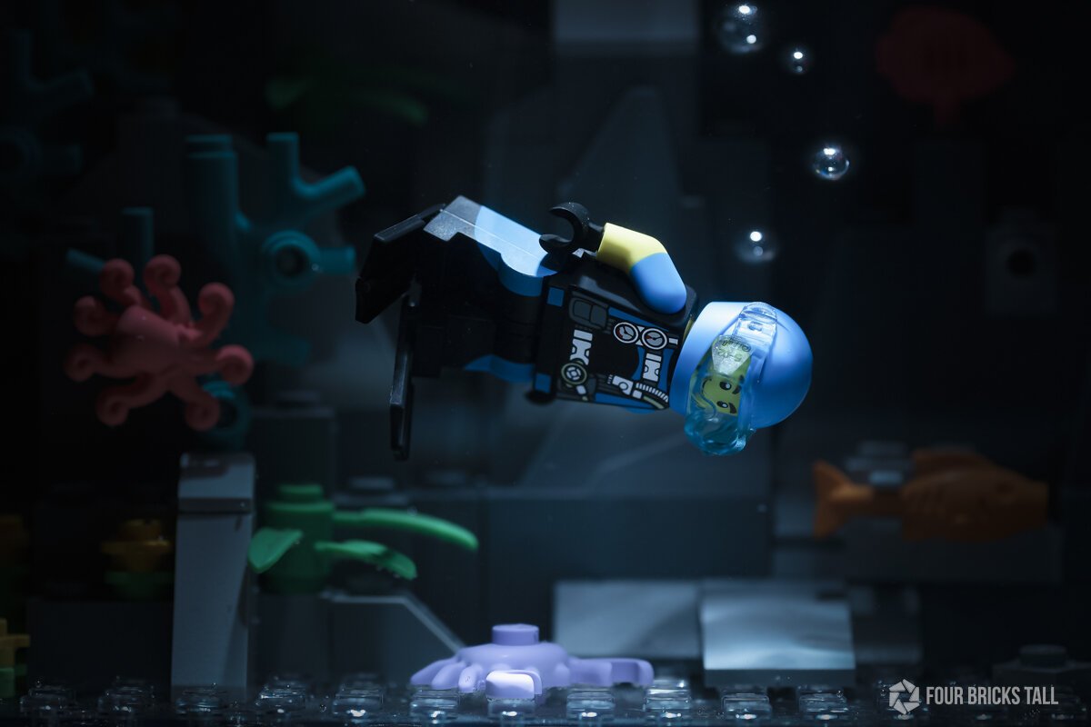 LEGO scuba diver underwater looking at a crab