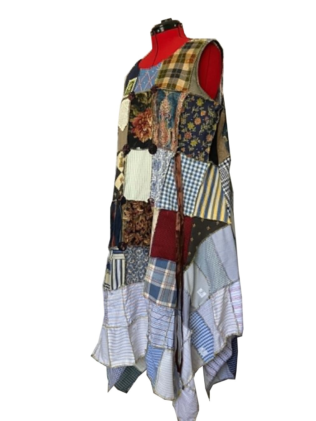 A dress on a red dress form, made from rectangles of decor fabric and shirting fabric.