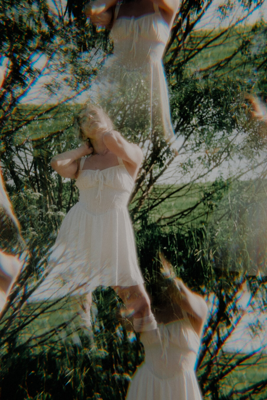 Summer portrait of a woman in a short white dress with optical effects.
