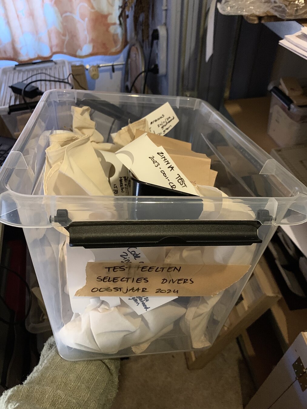 A box full of seed packets with flowerseeds harvested from our own selections last year.