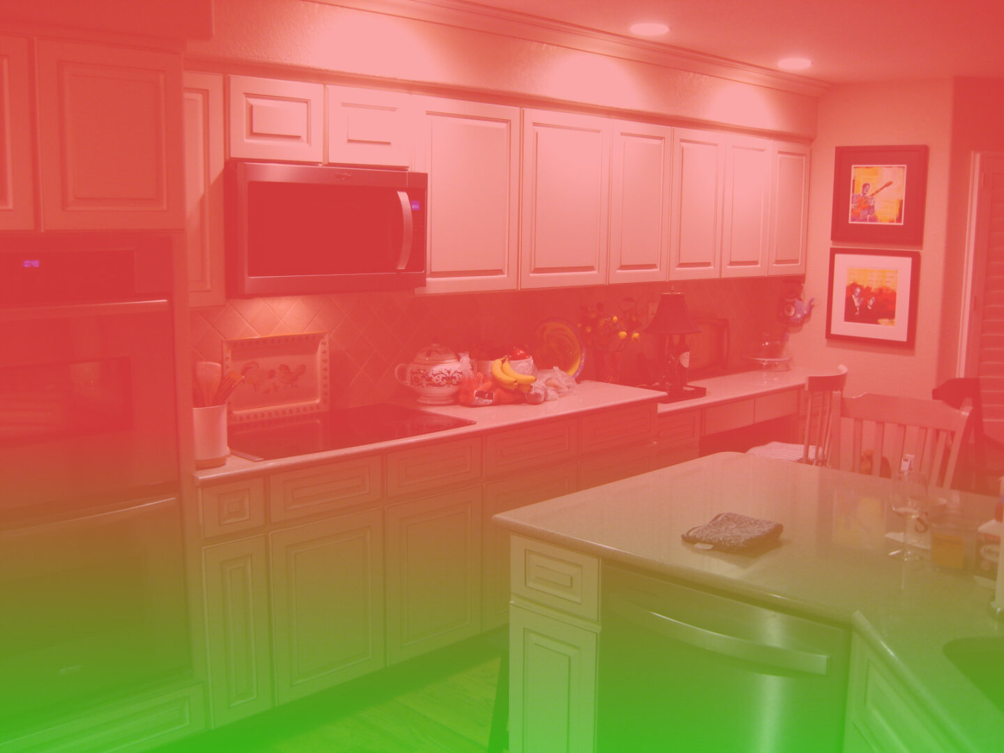 Photo of a kitchen with a pink-to-green gradient over it.