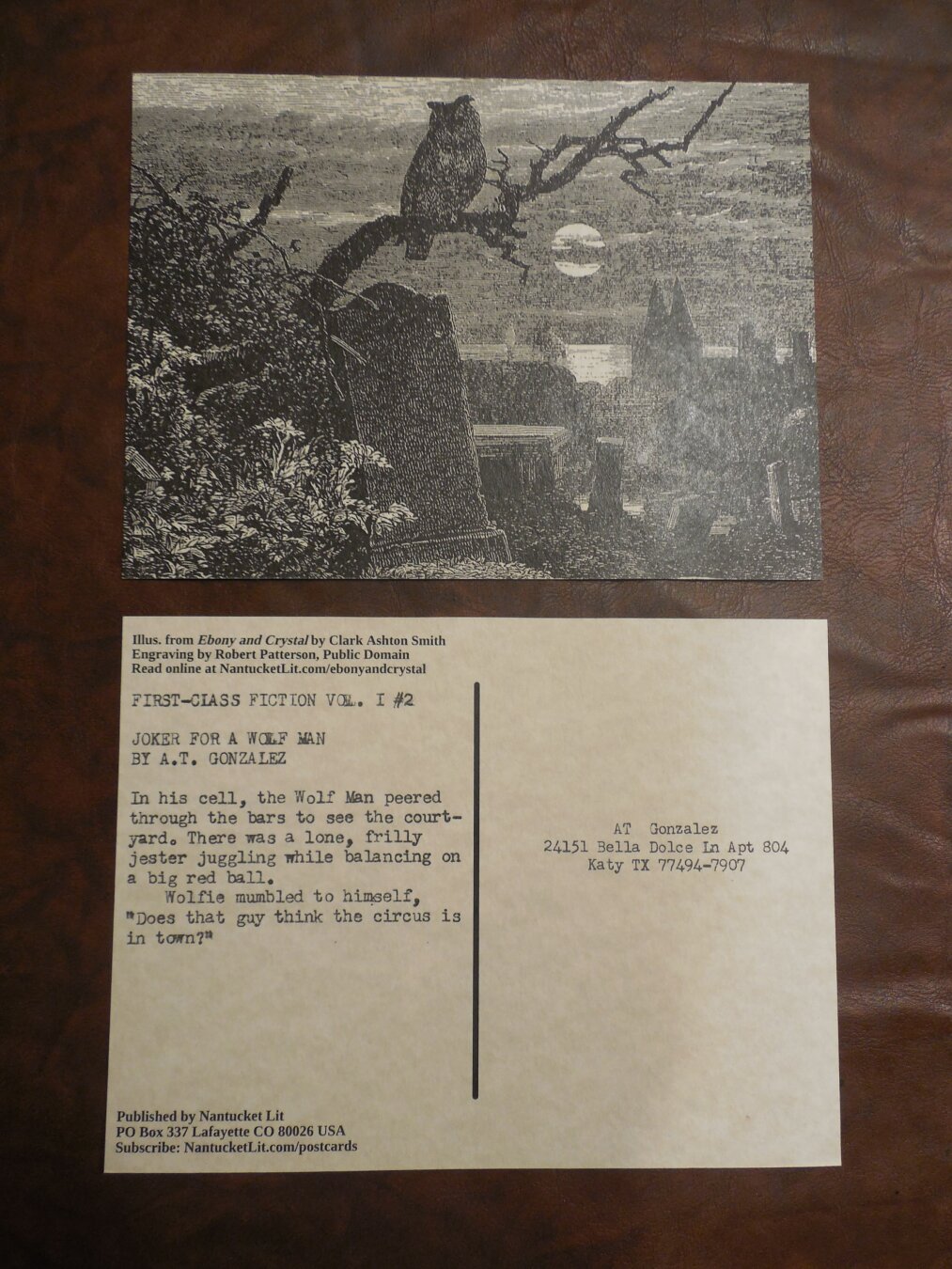 Two postcards, showing the front and back. The front shows an illustration of an owl in a moonlit graveyard. The back of the card has the text for Joker for a Wolf-Man by A.T. Gonzalez: 'In his cell, the Wolf-Man peered through the bars to see the courtyard. There was a lone, frilly jester juggling while balancing on a big red ball. Wolfie mumbled to himself, 'Does that guy think the circus is in town?'