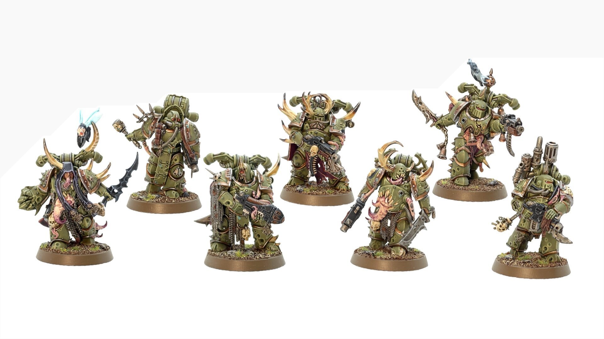 Painted squad of Death Guard Plague Marines, arranged in studio lighting on a white background