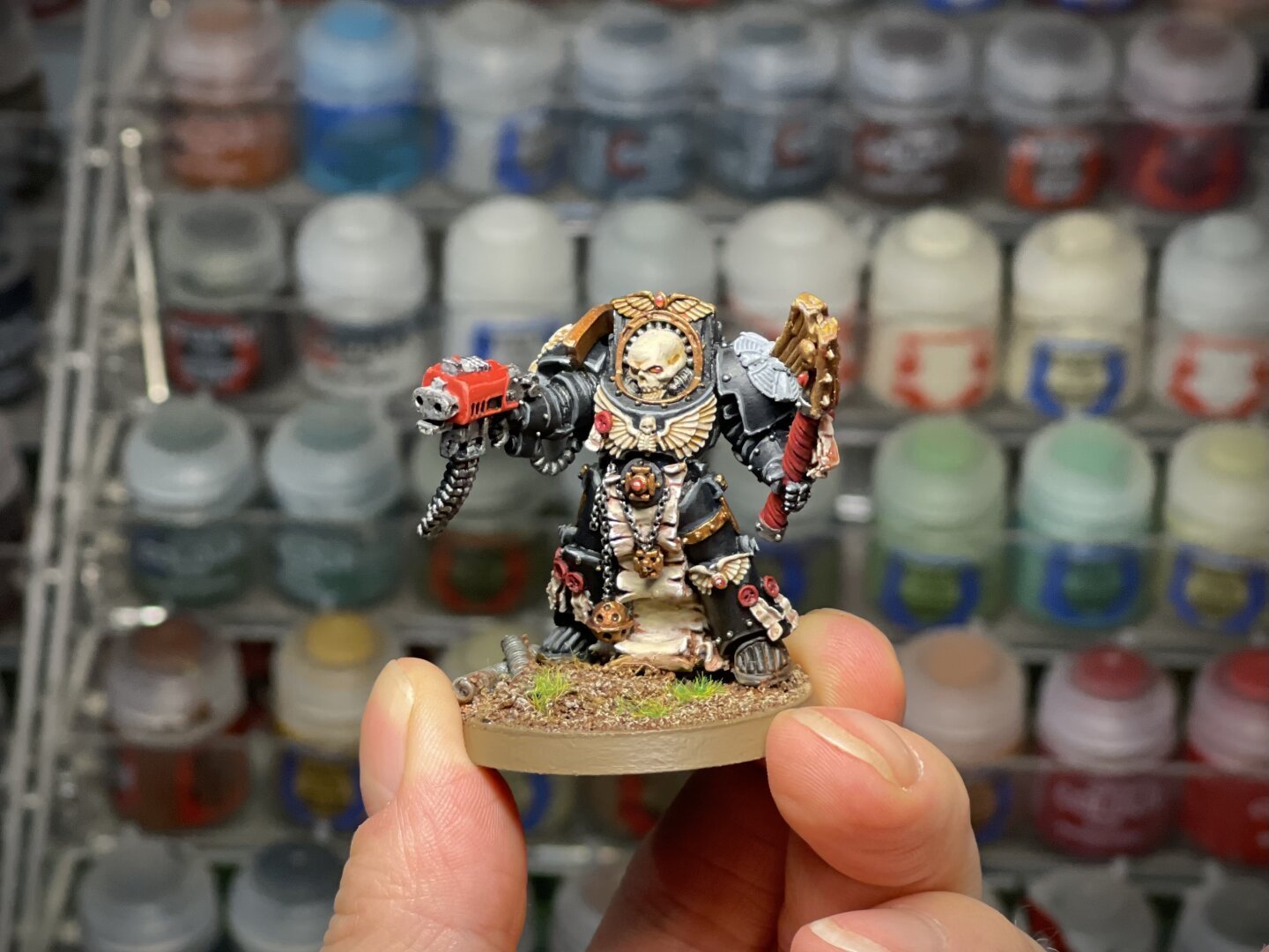 Painted WH40K Terminator Chaplain in black armor adorned with skulls