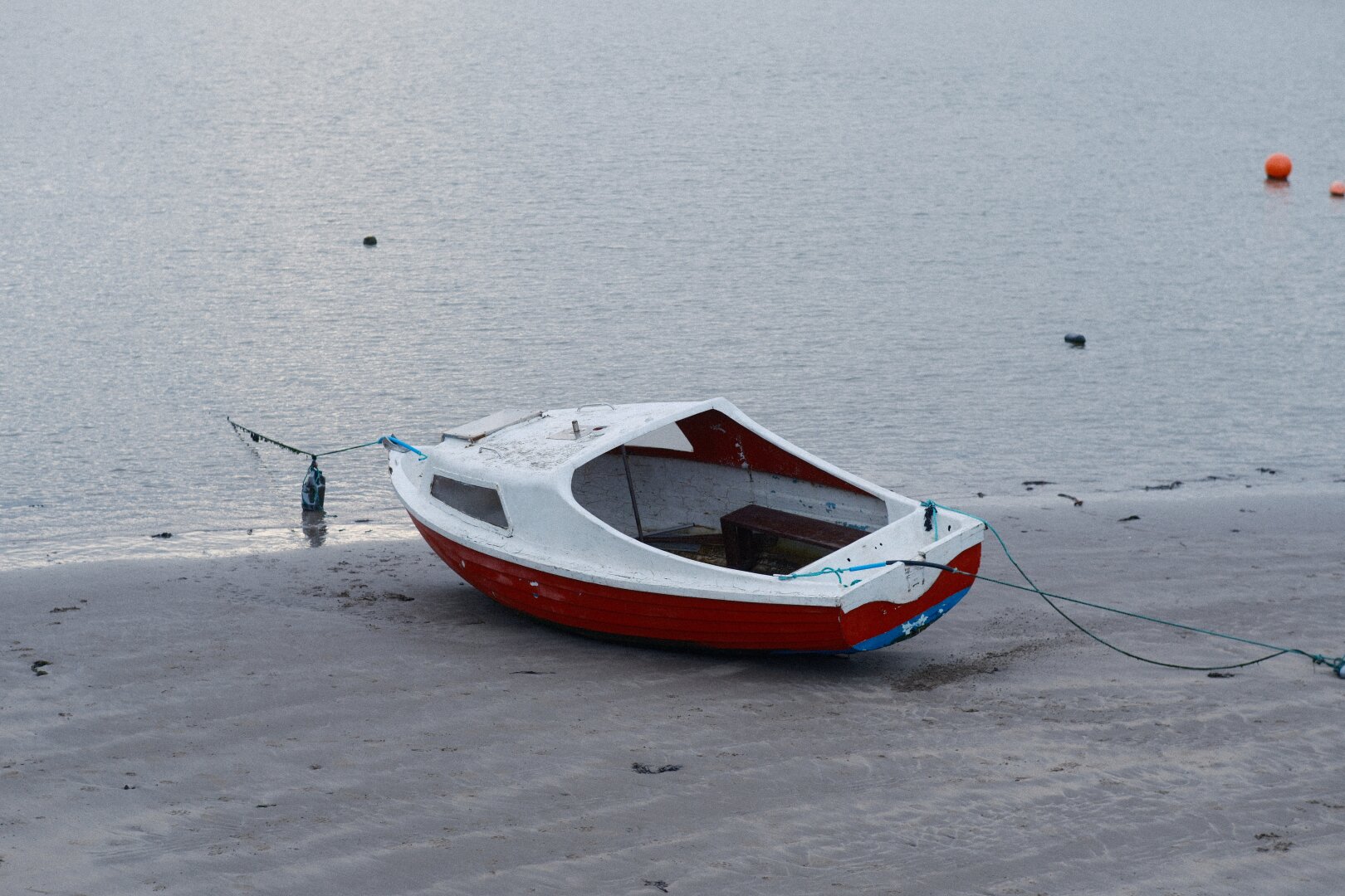 A Small Boat on a Bleak Beach