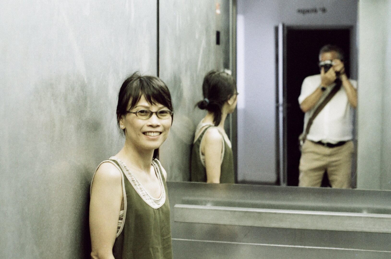 Film photography inside an elevator.