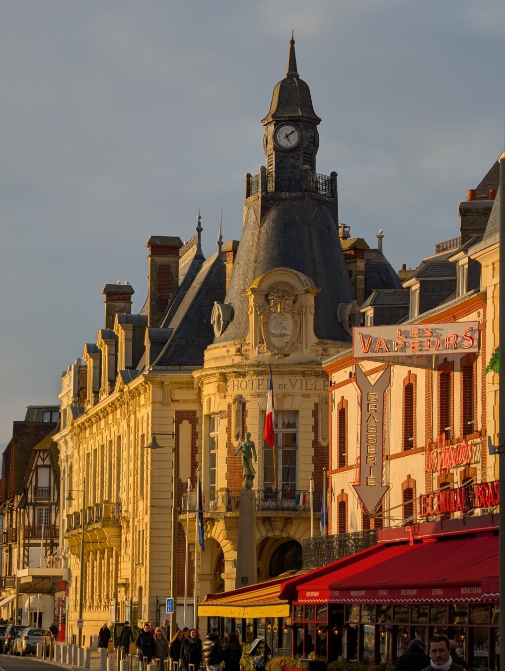 19th century buildings along a street in the evening sunlight.