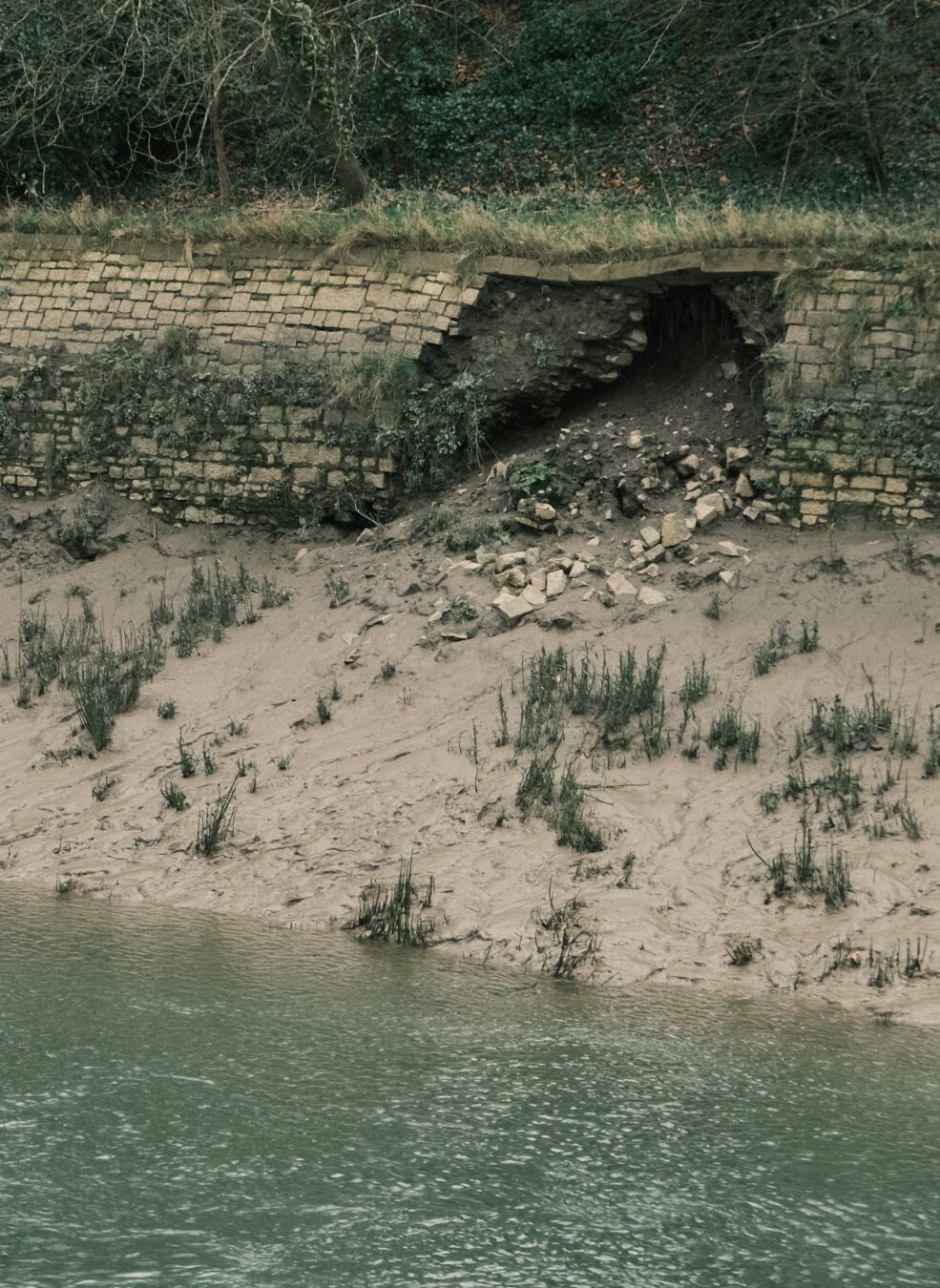 Stone river bank slowly falling appart.