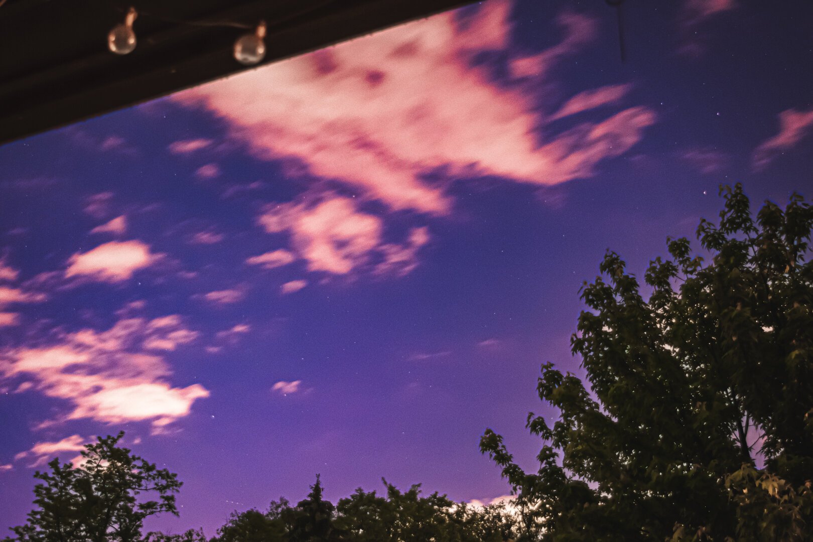 A long exposure photograph of aurora borealis as seen from my deck over the suburbs of Pittsburgh, Pennsylvania, US.