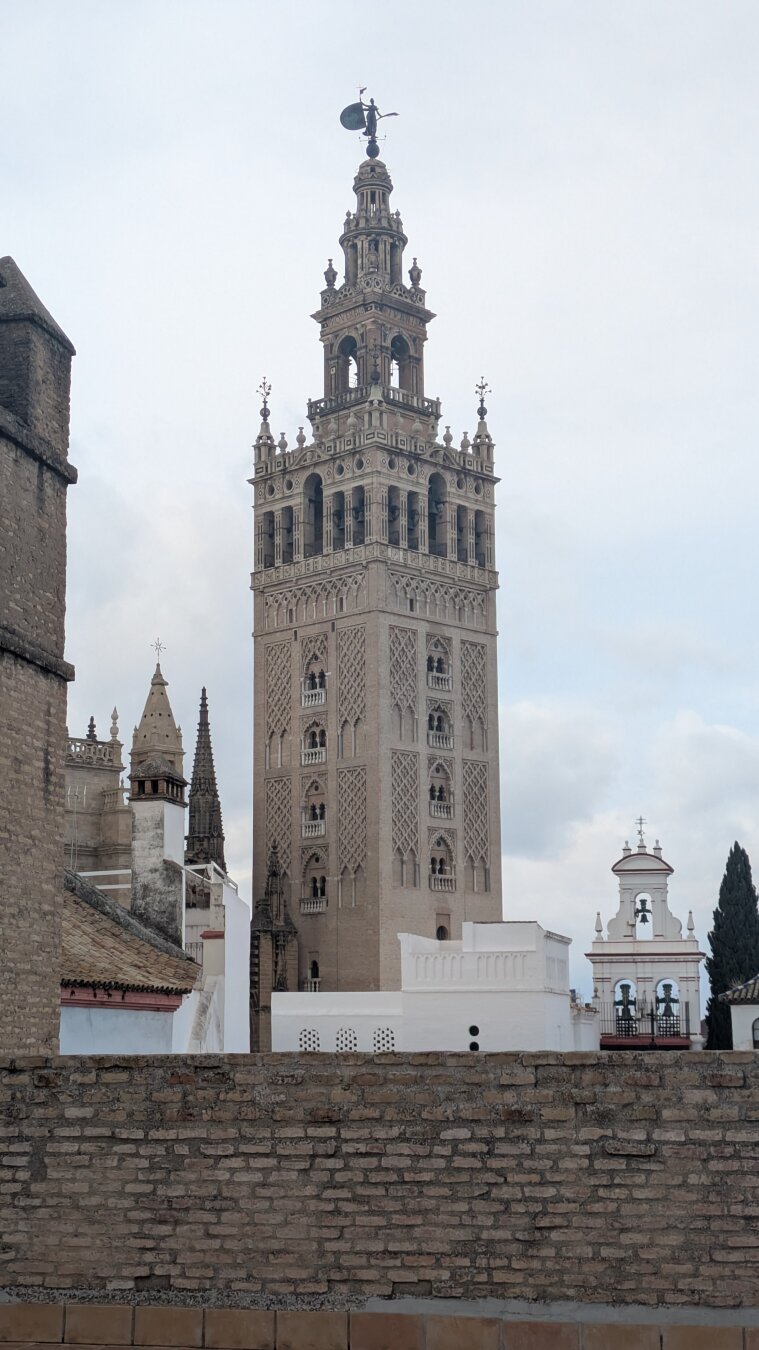 The tower viewed from a nearby rooftop on a cloudy day