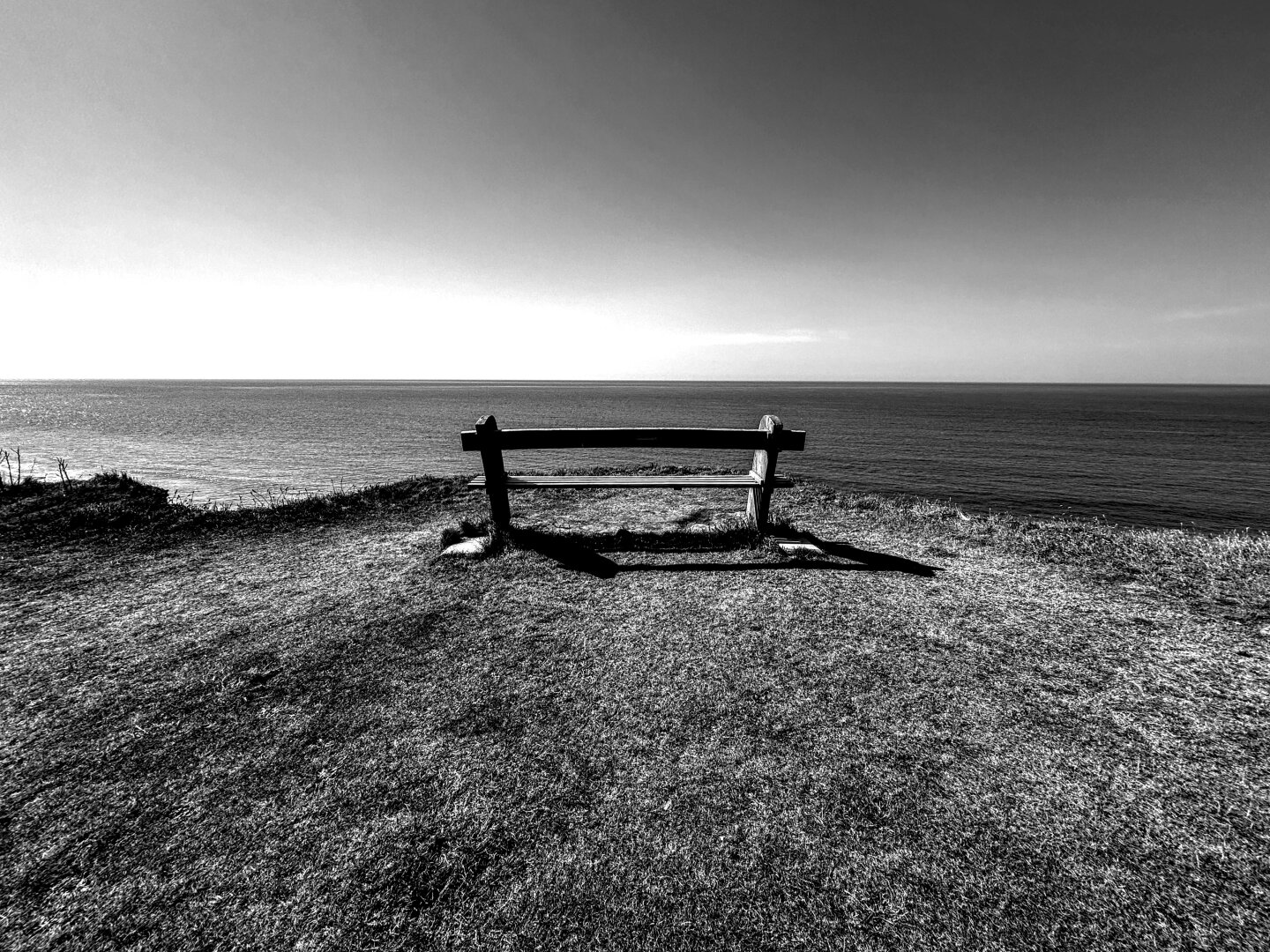 A lonely bench with a sea view