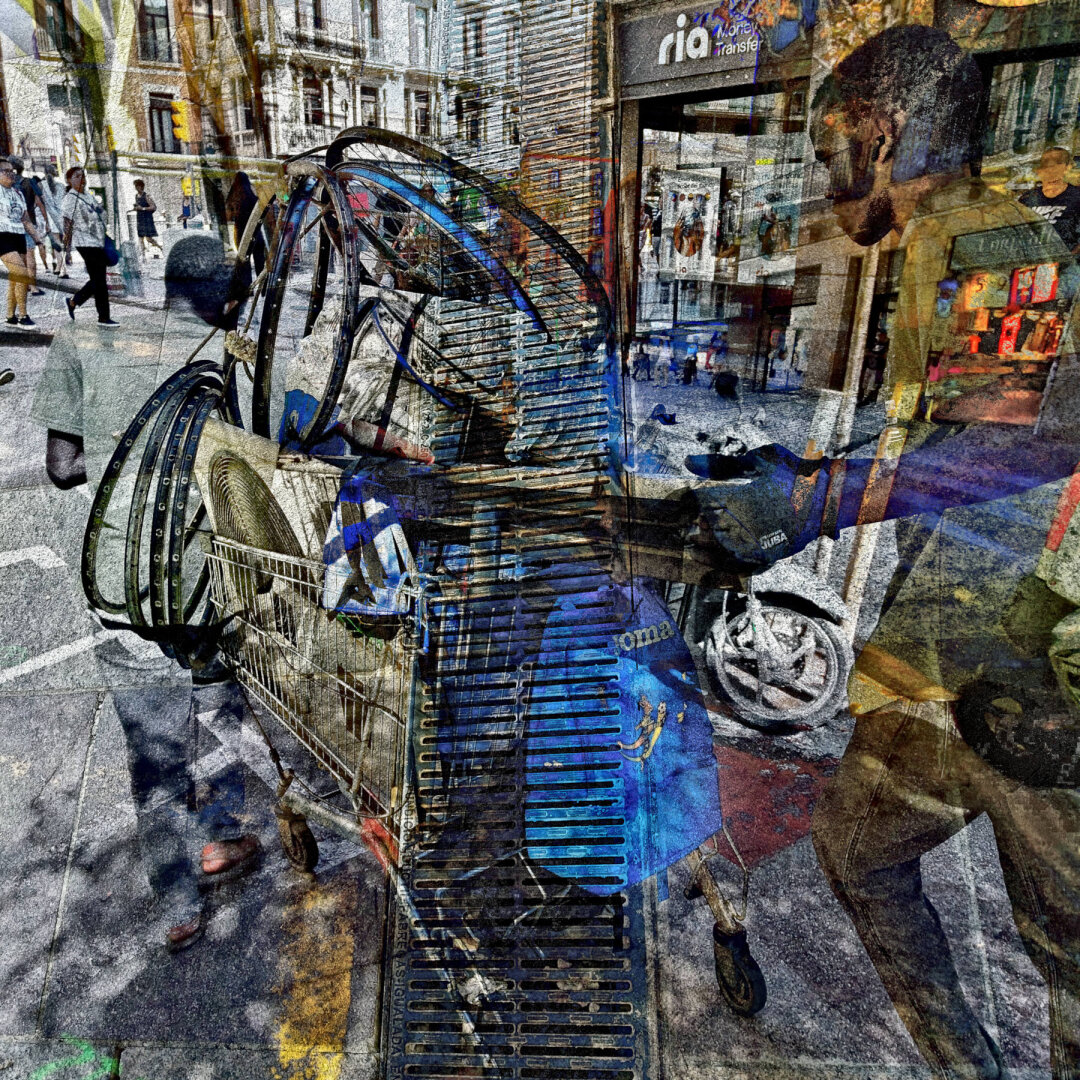 A busy street scene with a shopping cart filled with various items and people walking by, along with buildings and storefronts in the background.