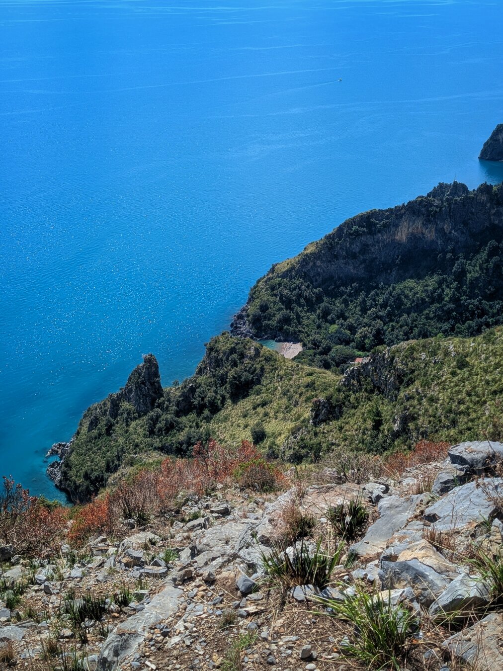 From the hiking trail descending from the Pianoro di Ciolandrea, a view of the bay (Baia del Marcellino) and the Tyrrhenian Sea.