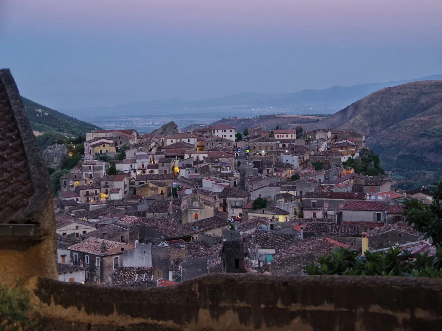 Panoramic view of the village of Civita at dusk