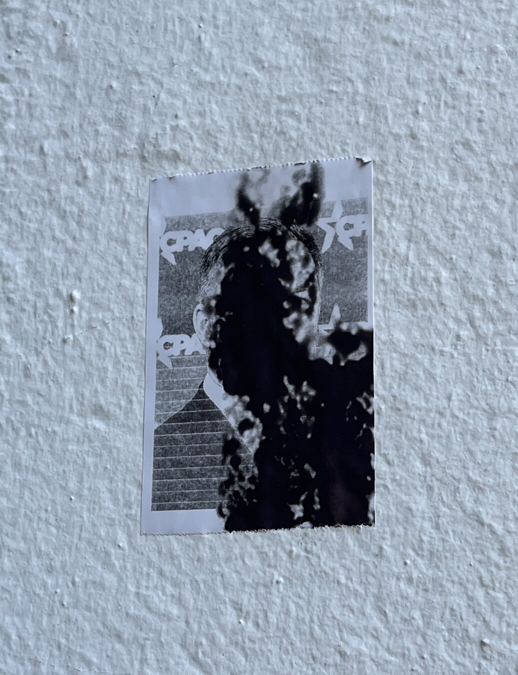 street Art   greytones sticker on a white wall