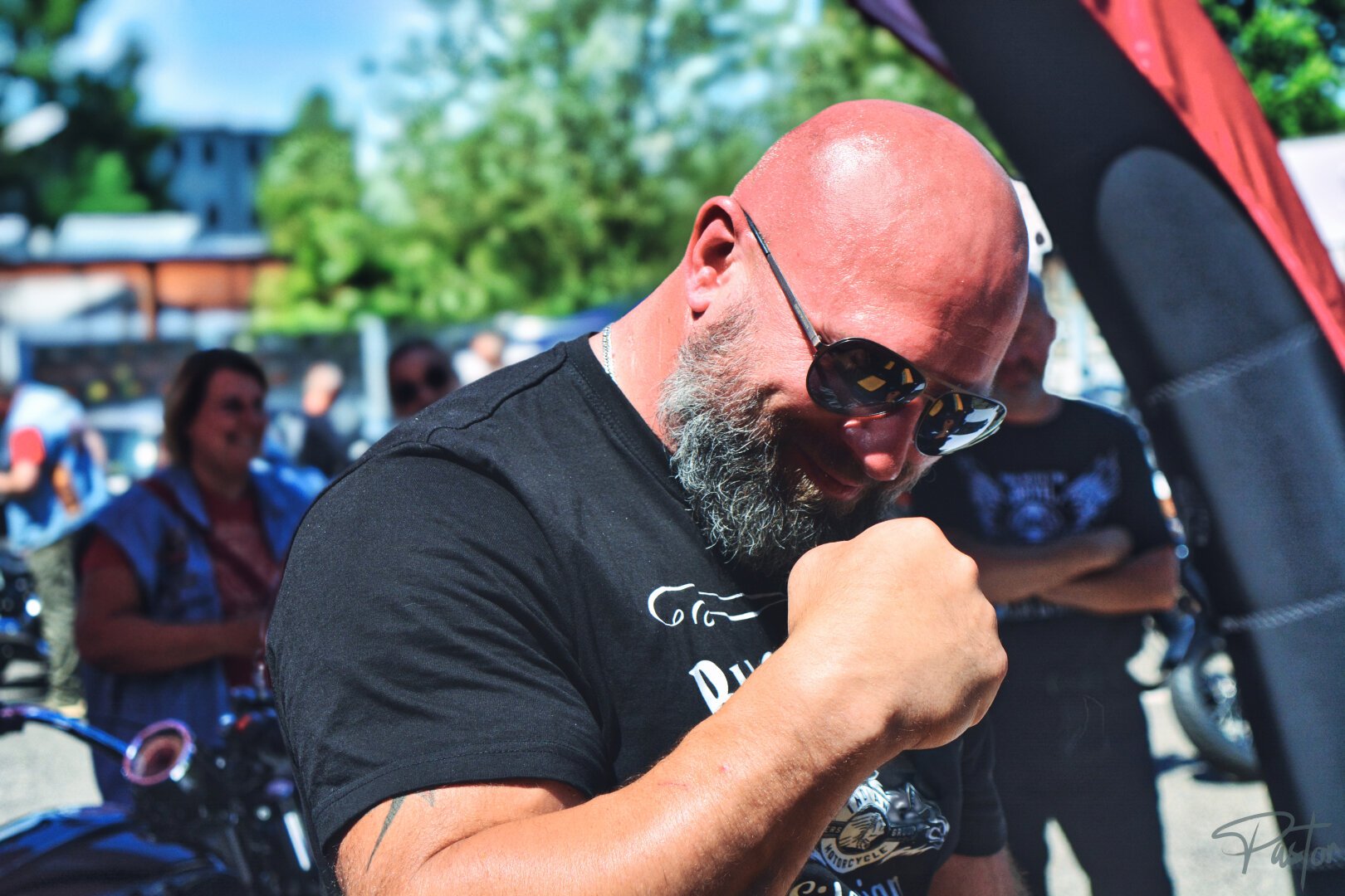 an arm wrestler showing his power within his hand holding it up