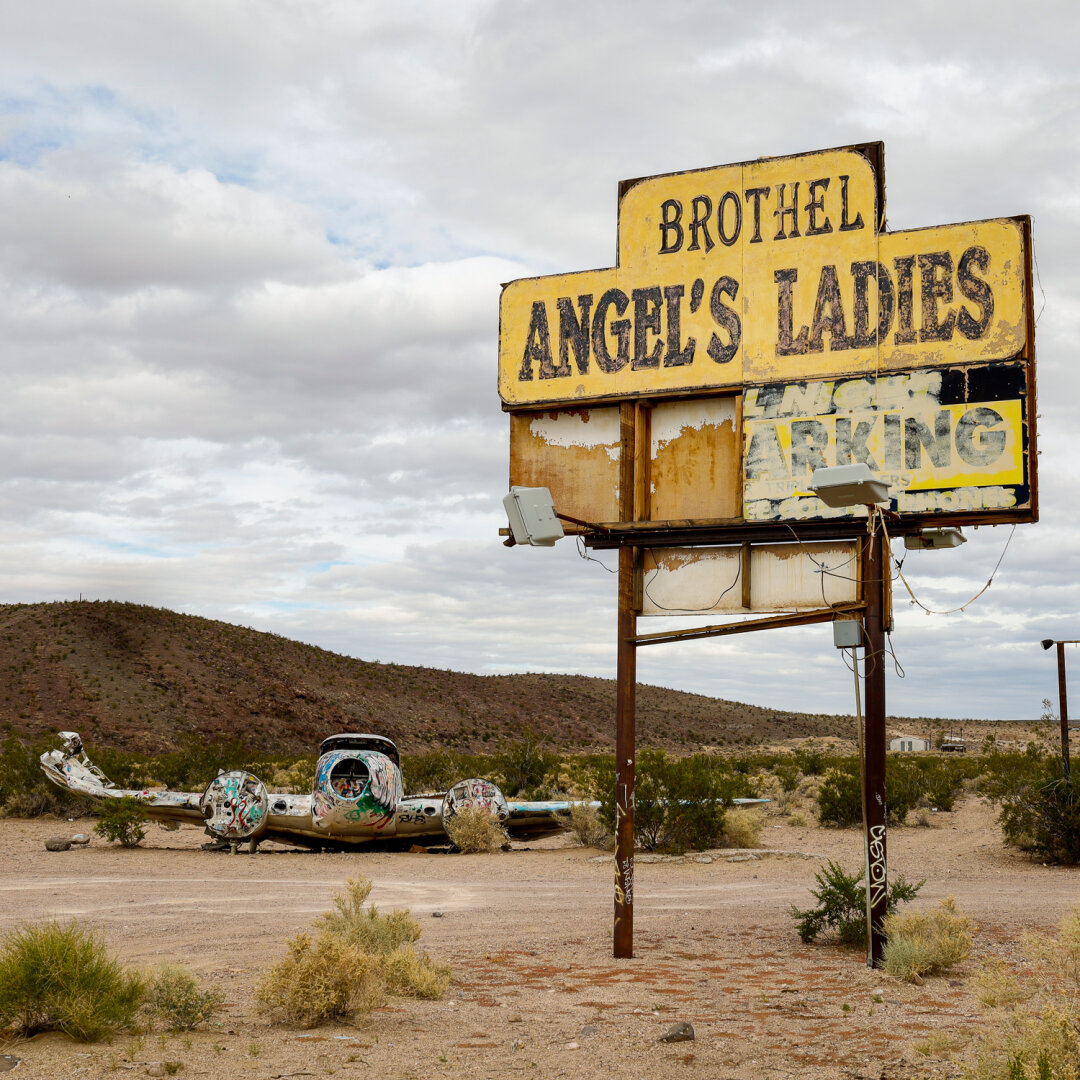 An abandoned brothel and crashed plane in the Nevada desert.