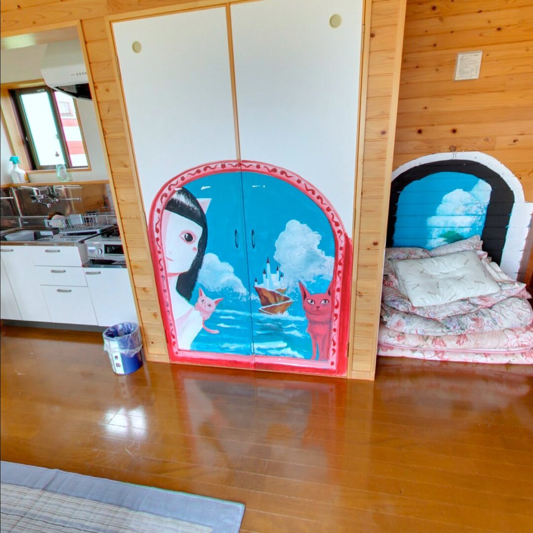 cat paintings inside of a cat shaped cabin