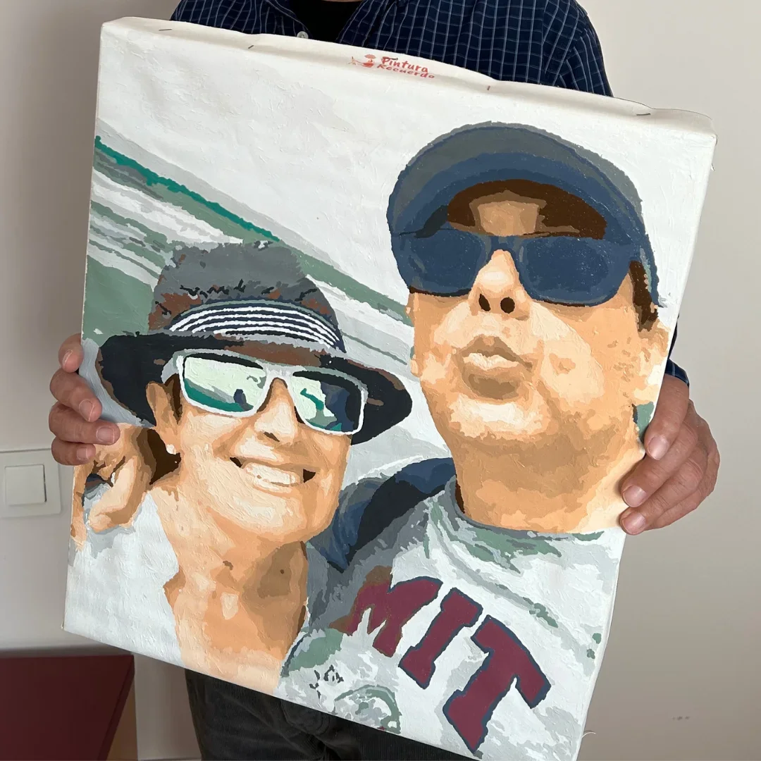 A close-up selfie of a couple on the beach.