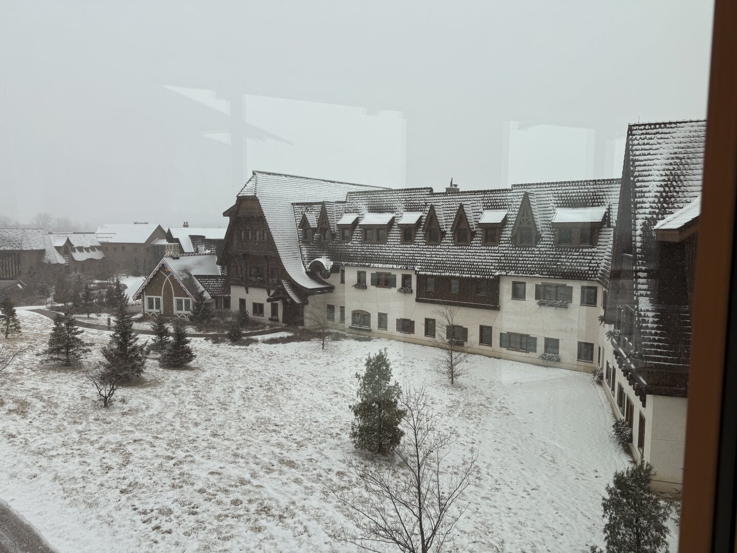 Snow falling on a timber-framed/Elizabethan stylized office building (complete with gingerbread house)