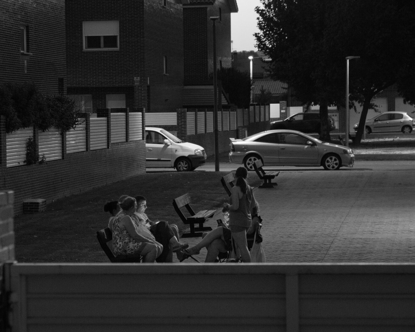 10/365 — Neighbors

Years ago, the neighbors sitting outside in the evening were the neighborhood watch. Nothing that happened around them went unnoticed.

This particular group would probably be described as cotillas — the local gossips — strategically positioned in the square with a clear view of almost every house.

These days, though, everyone is looking at a screen. I suppose we still keep an eye on each other; we just do it on social media instead.

#365project #blackandwhite #monochrome #streetphotography #everydayphotography #neighborhood