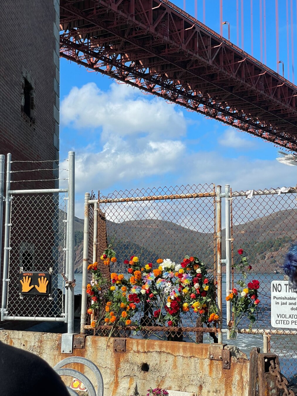 Flowers placed as a memorial under the Golden Gate Bridge
