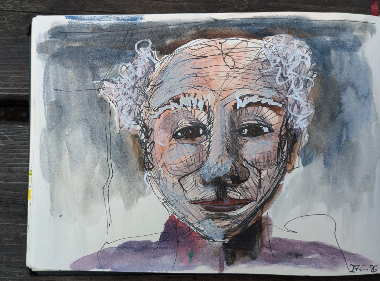 A drawing of an elderly man in a sketchbook