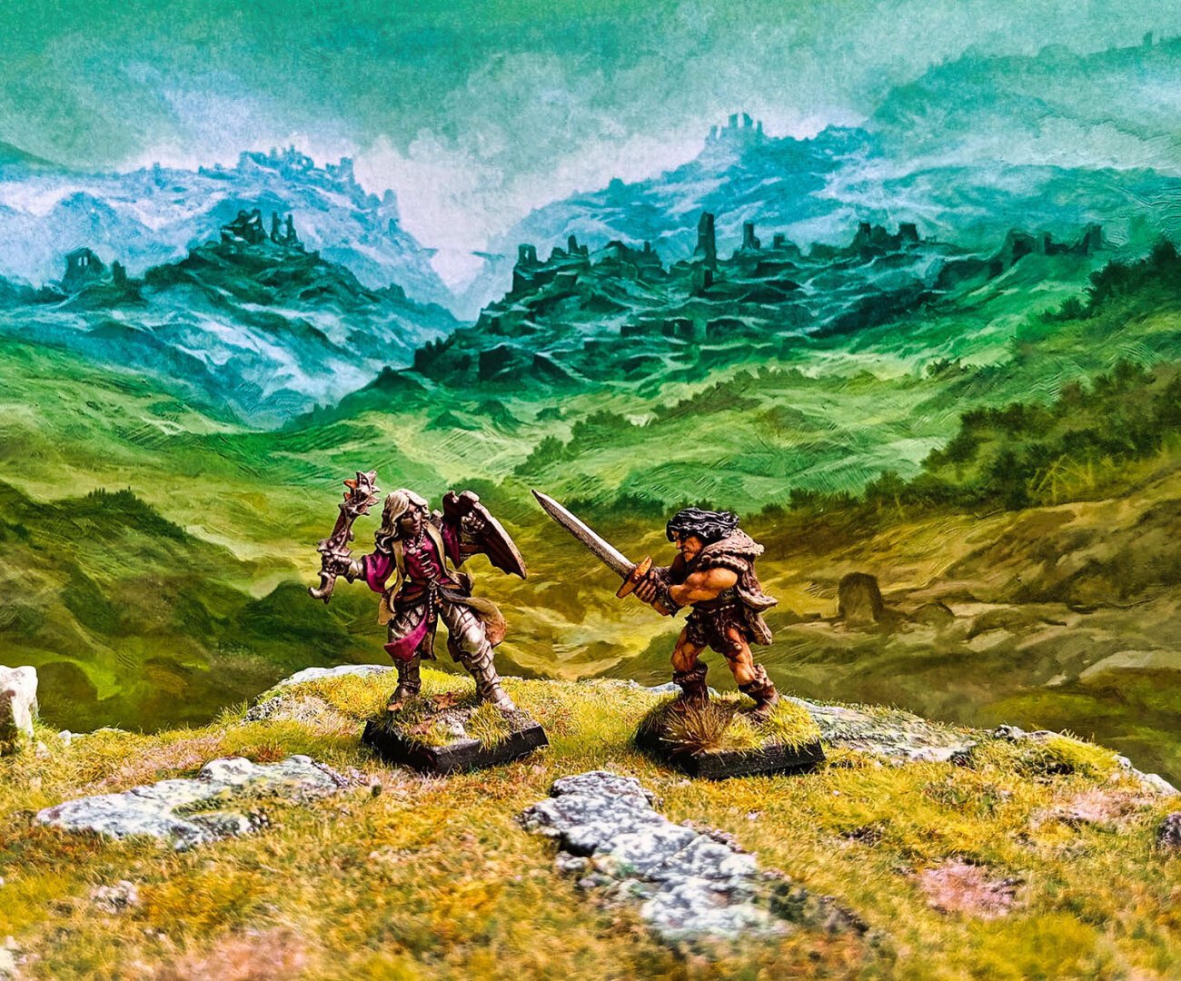 A drow cleric and a barbarian clash in a desolate landscape.
Miniatures from Reaper and Alterntive Armies.