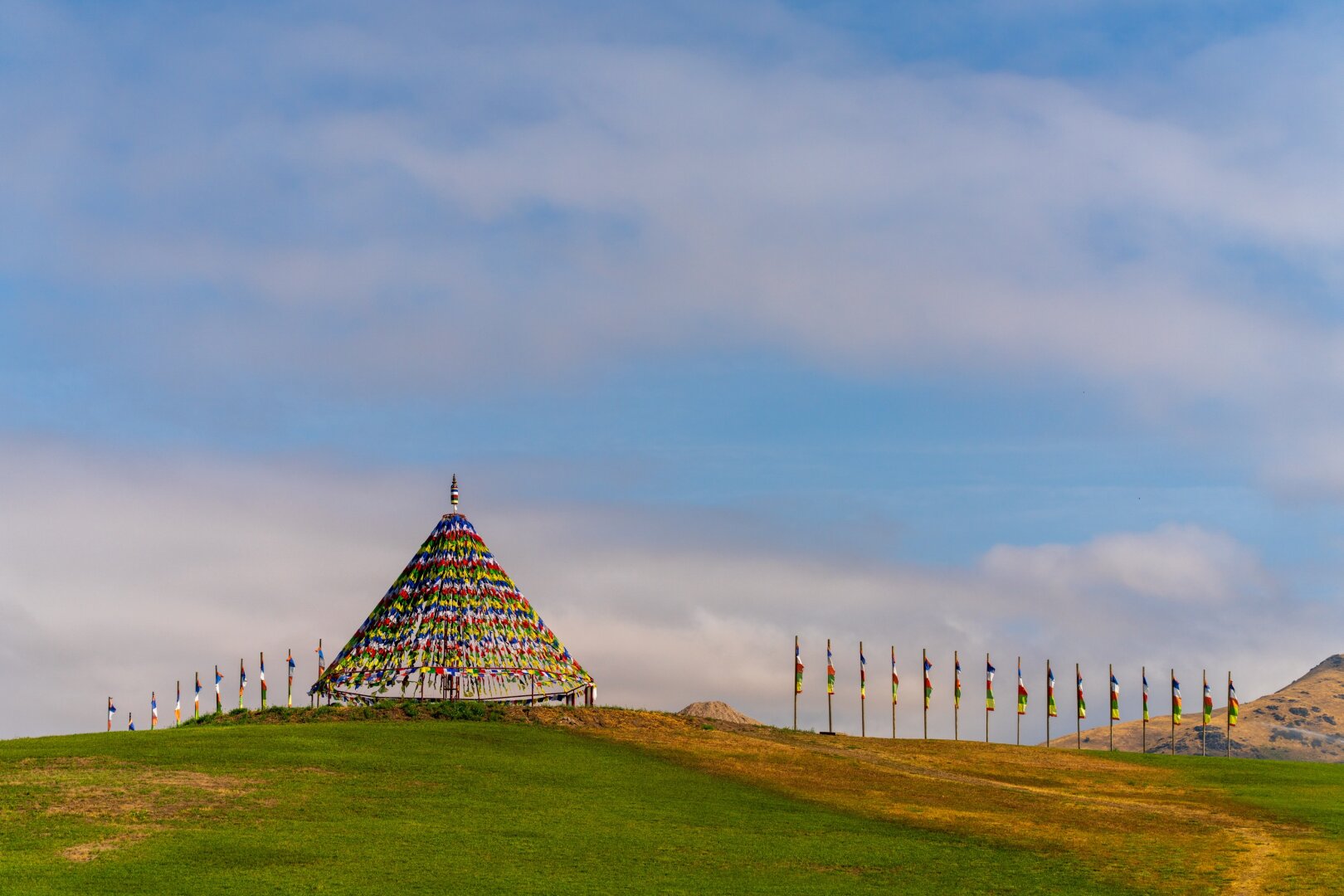 Many prayer flags on top of a hill. [Sony A7R V / Tamron 25-200]