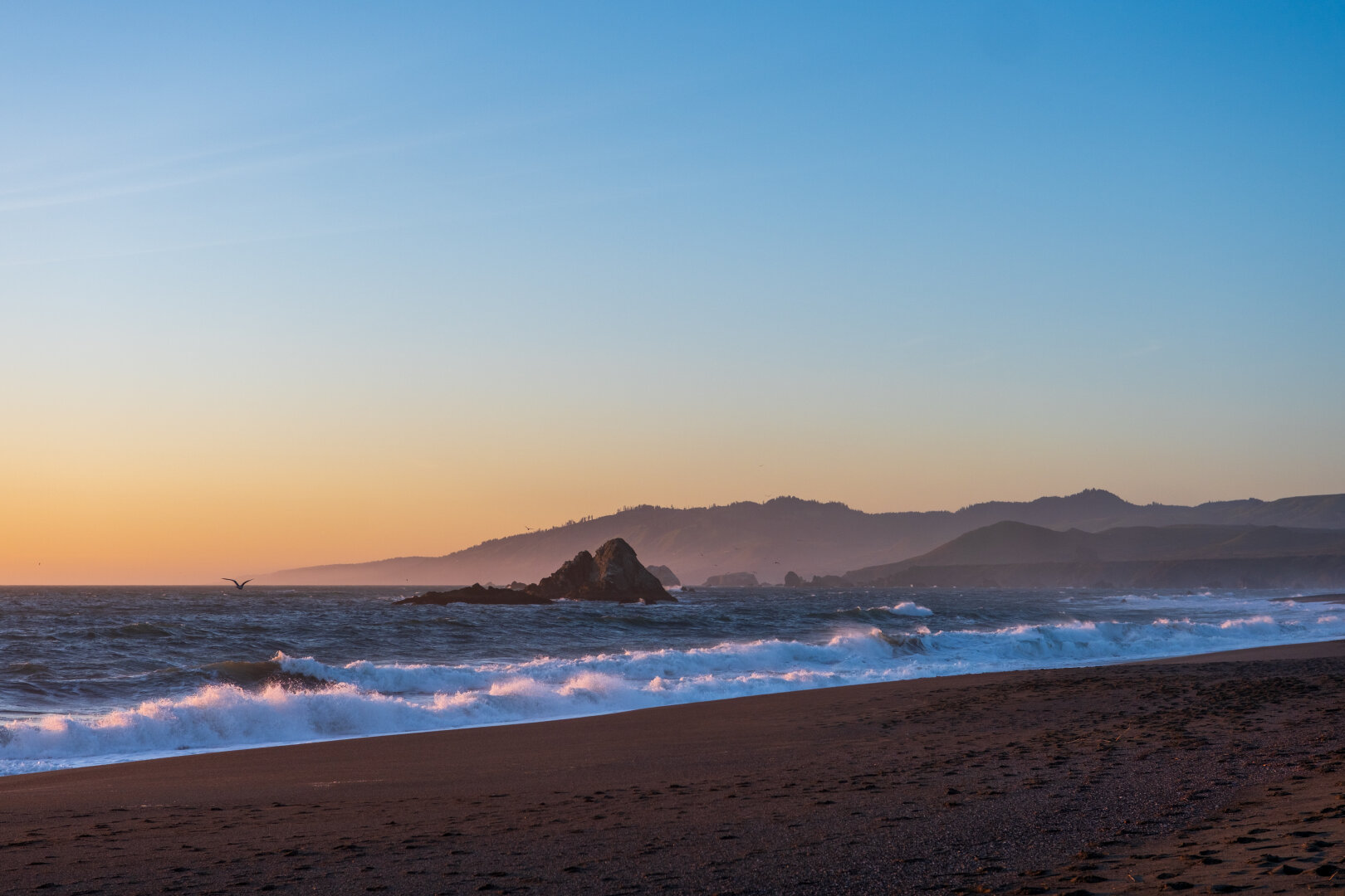 Large rocks in the sea, pictured at sunset. [Fuji X-T5 / Sigma 17-40 1.8]