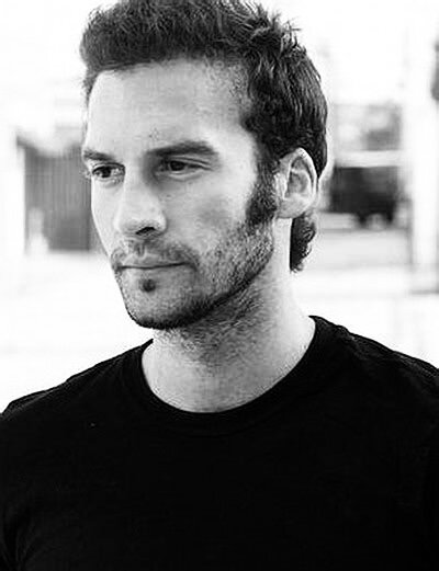 Black and white headshot of late actor TJ Roberts