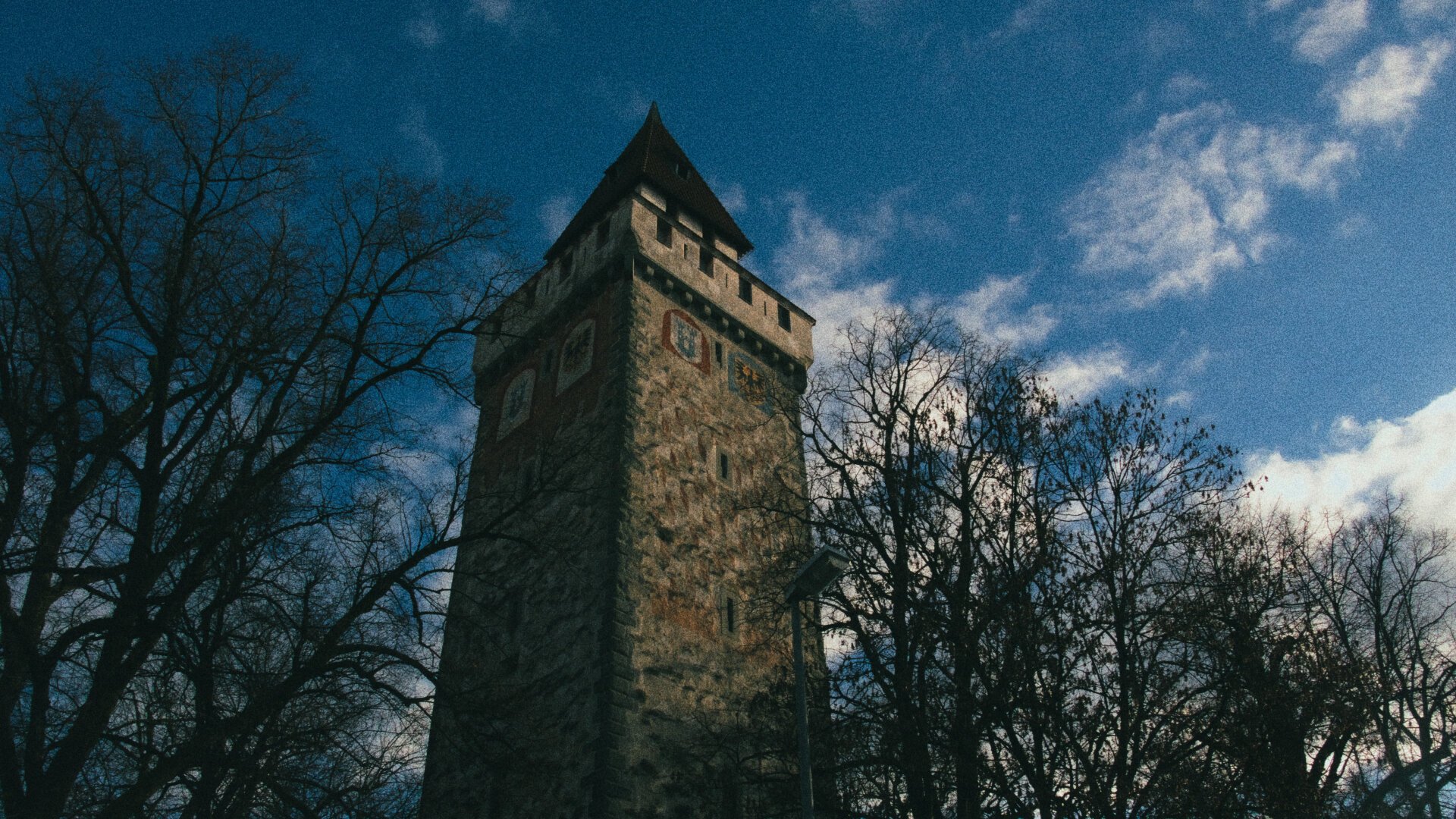 Photo of a tower in Ravensburg against a blue sky.