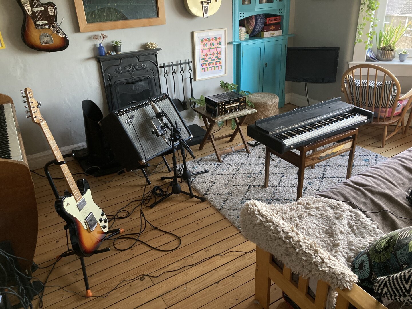 a room at home set up for recording: telecaster, fender amp, hohner pianet, dynacord tape echo